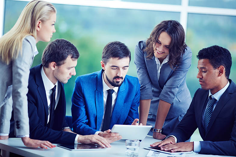 Several confident employees gathered at workplace discussing data